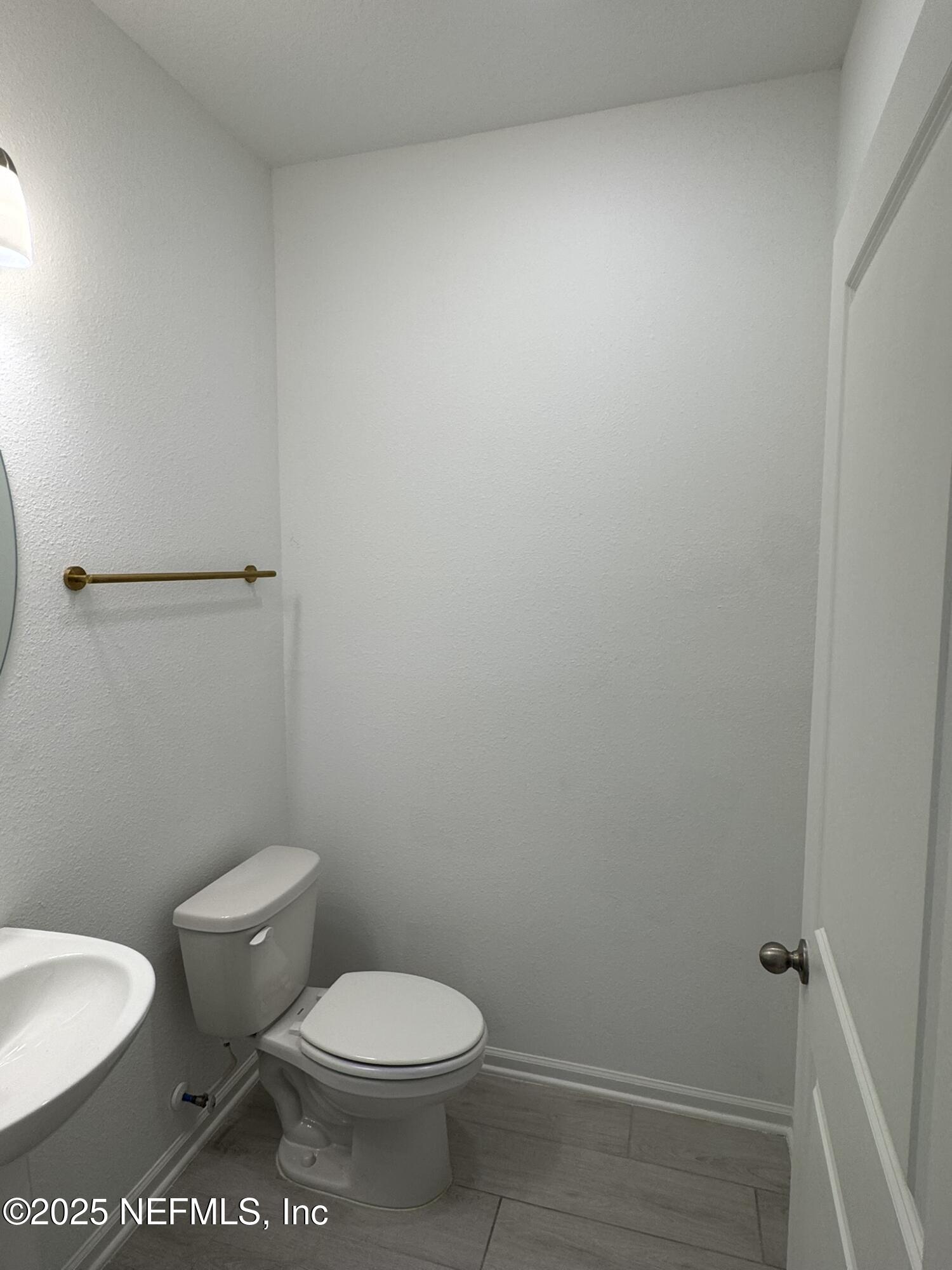 3145 Flower Branch Avenue Orange Park, FL 32073 - Photo 12 of 52 a white toilet sitting next to a shower