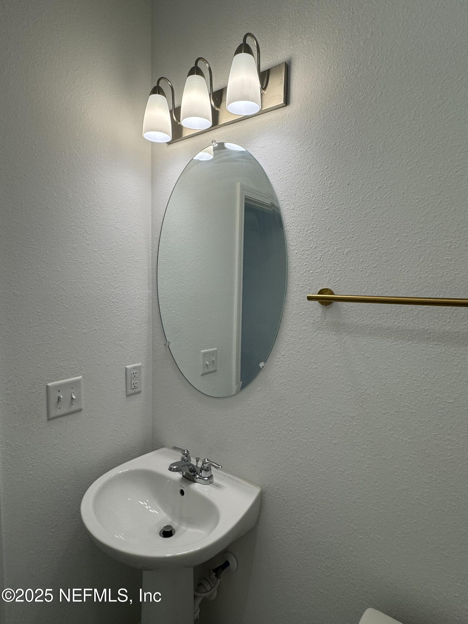 3145 Flower Branch Avenue Orange Park, FL 32073 - Photo 13 of 52 a bathroom with a sink and a mirror