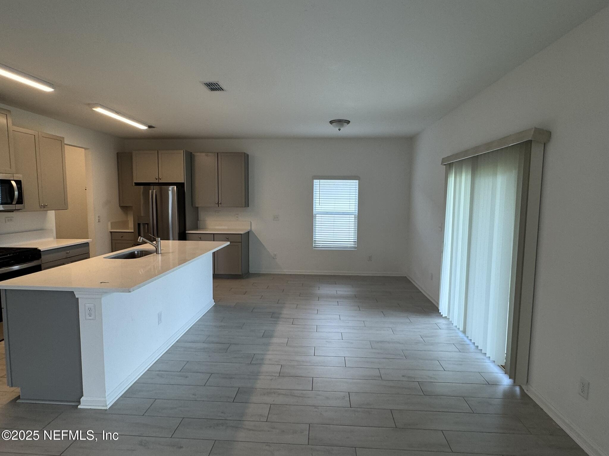 3145 Flower Branch Avenue Orange Park, FL 32073 - Photo 17 of 52 a kitchen with stainless steel appliances granite countertop a sink and cabinets