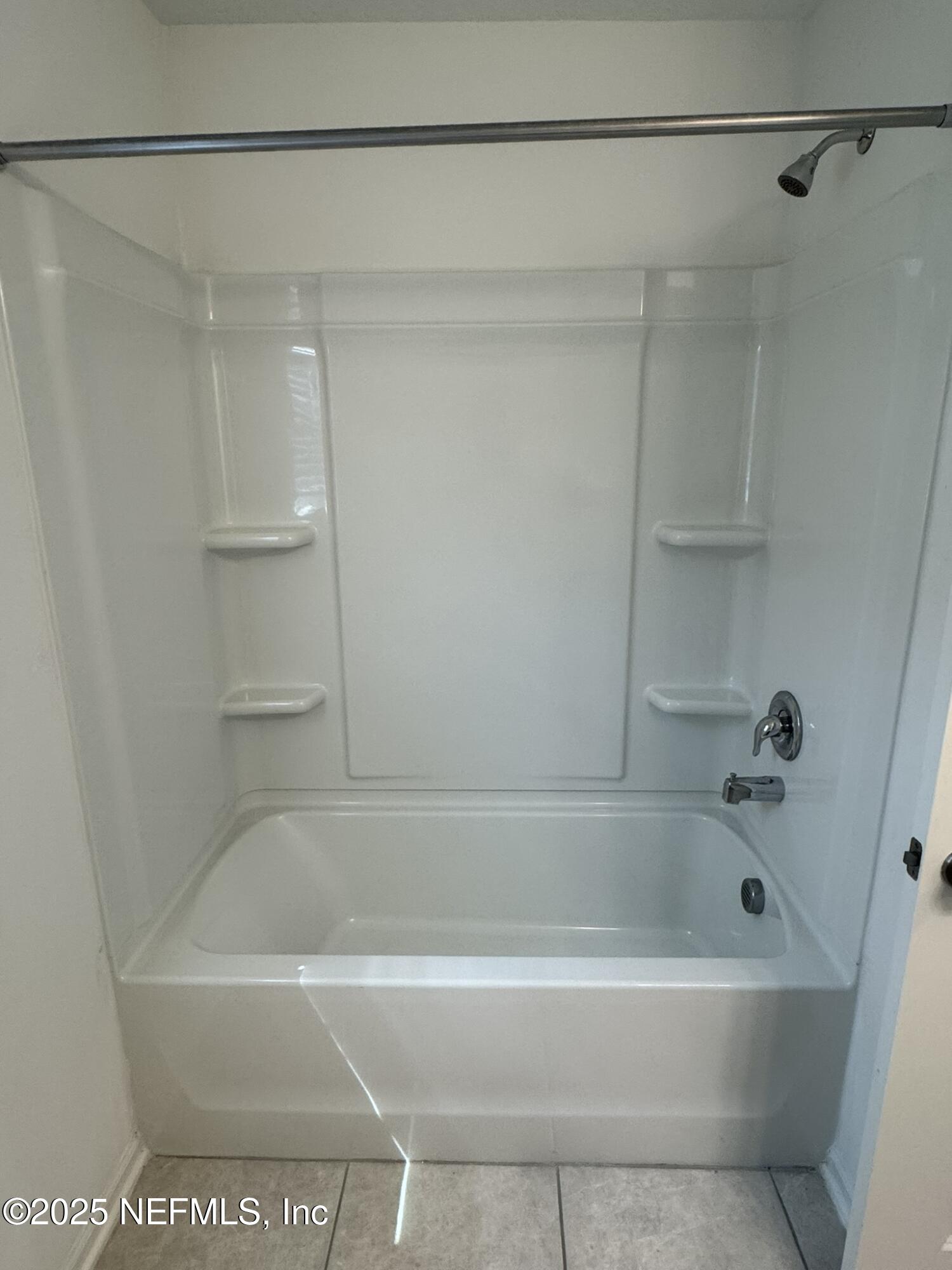 3145 Flower Branch Avenue Orange Park, FL 32073 - Photo 28 of 52 a white bath tub and a shower