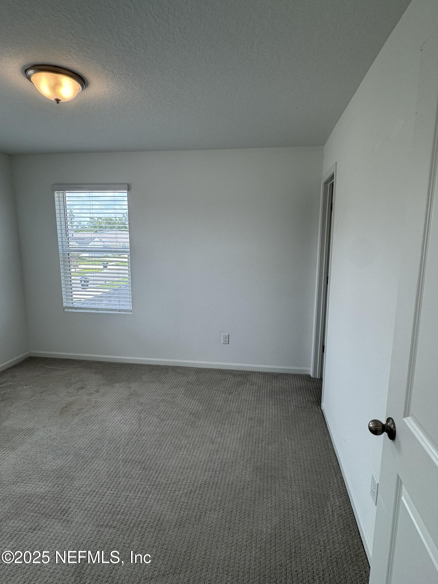 3145 Flower Branch Avenue Orange Park, FL 32073 - Photo 29 of 52 an empty room with a window
