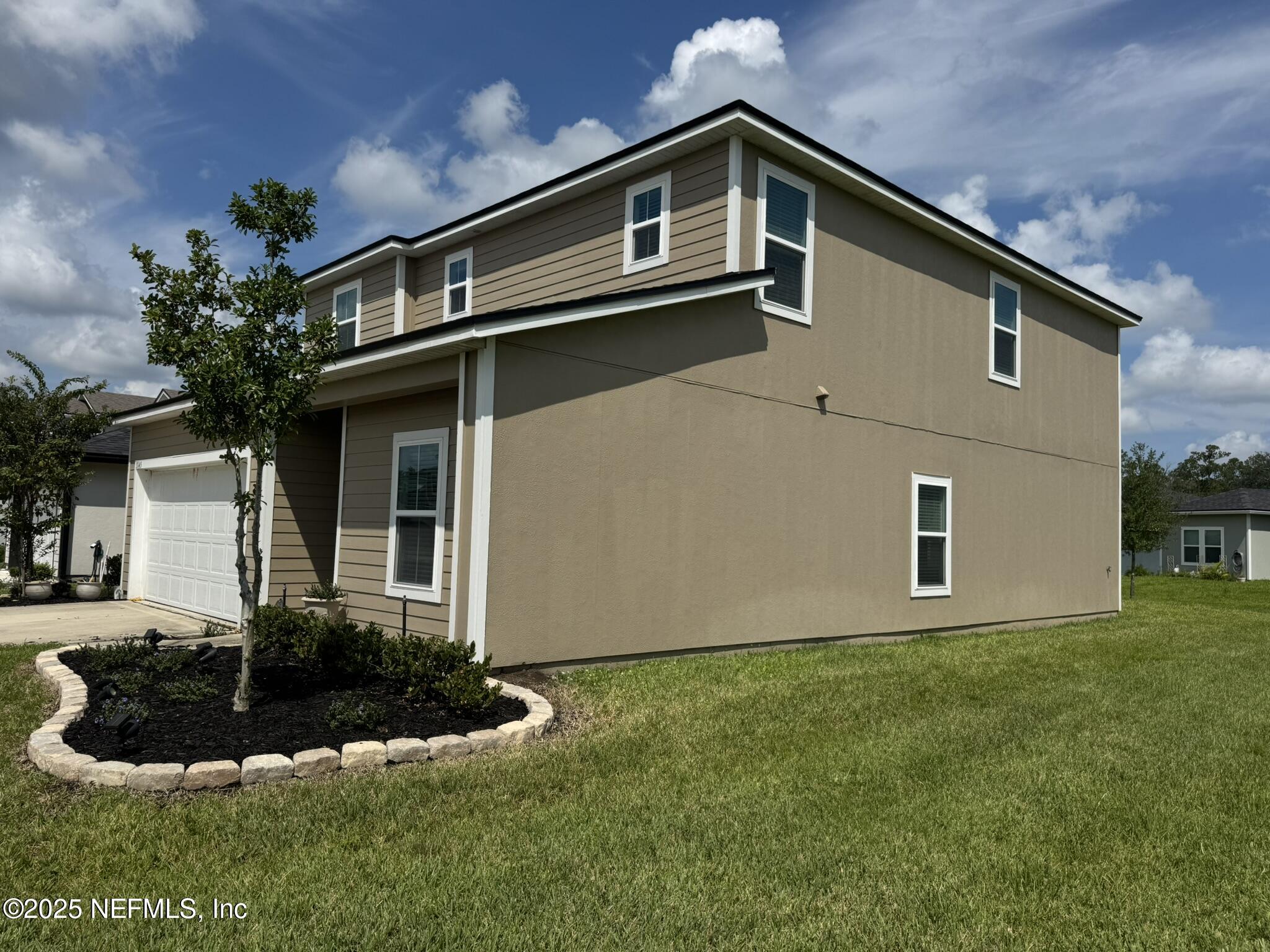 3145 Flower Branch Avenue Orange Park, FL 32073 - Photo 3 of 52 a front view of house with yard and garage
