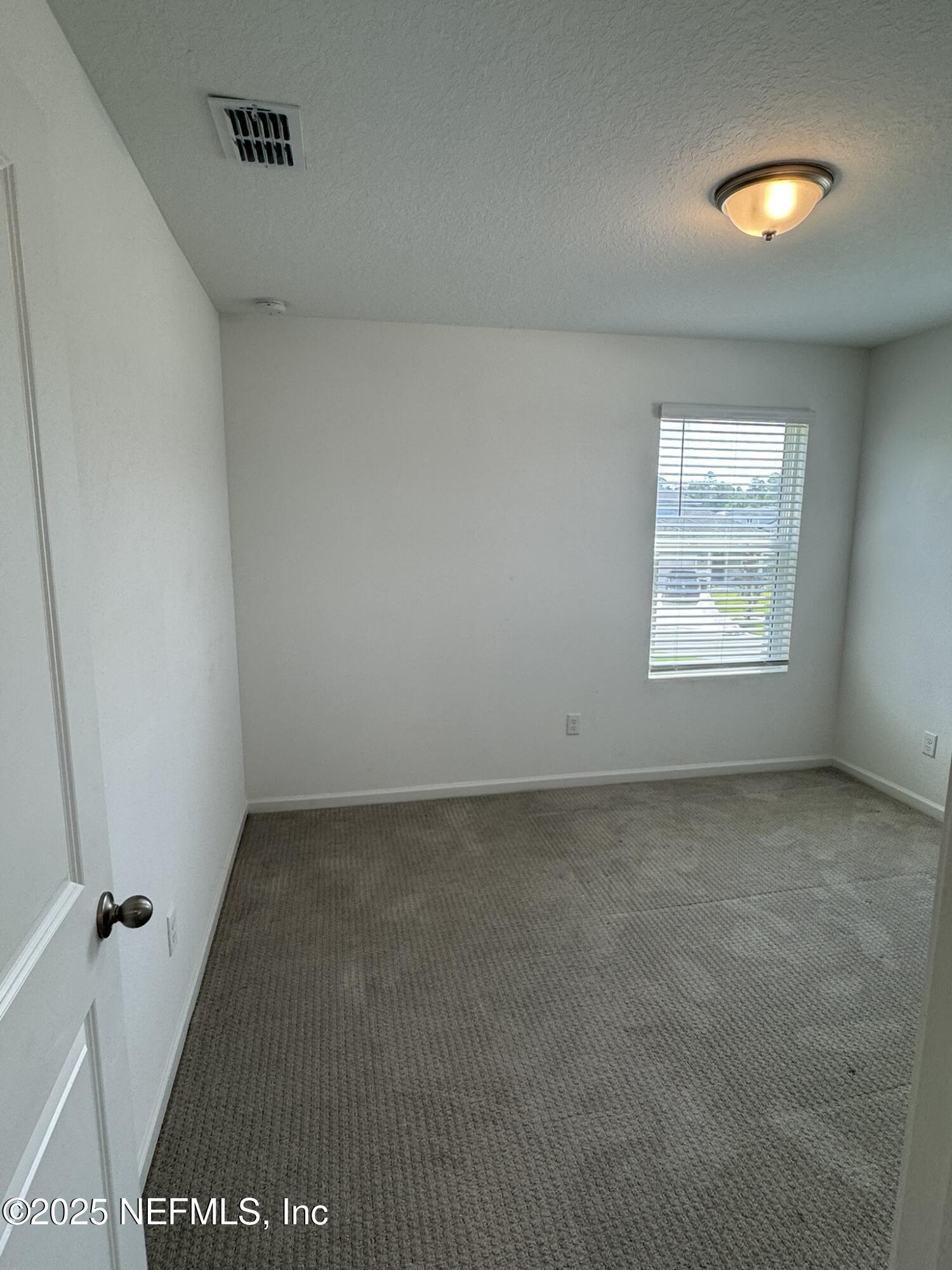 3145 Flower Branch Avenue Orange Park, FL 32073 - Photo 32 of 52 an empty room with a window