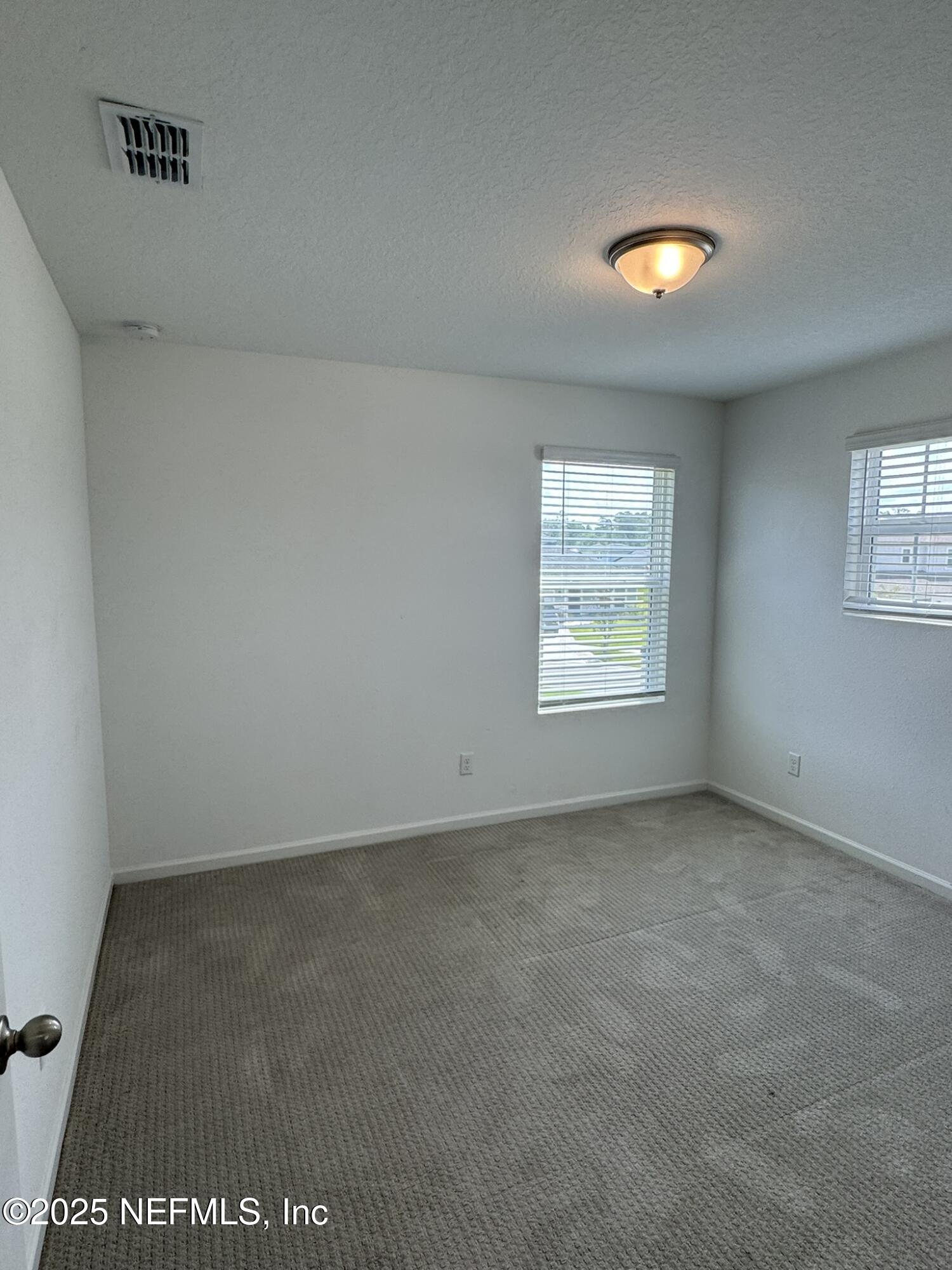 3145 Flower Branch Avenue Orange Park, FL 32073 - Photo 33 of 52 an empty room with windows