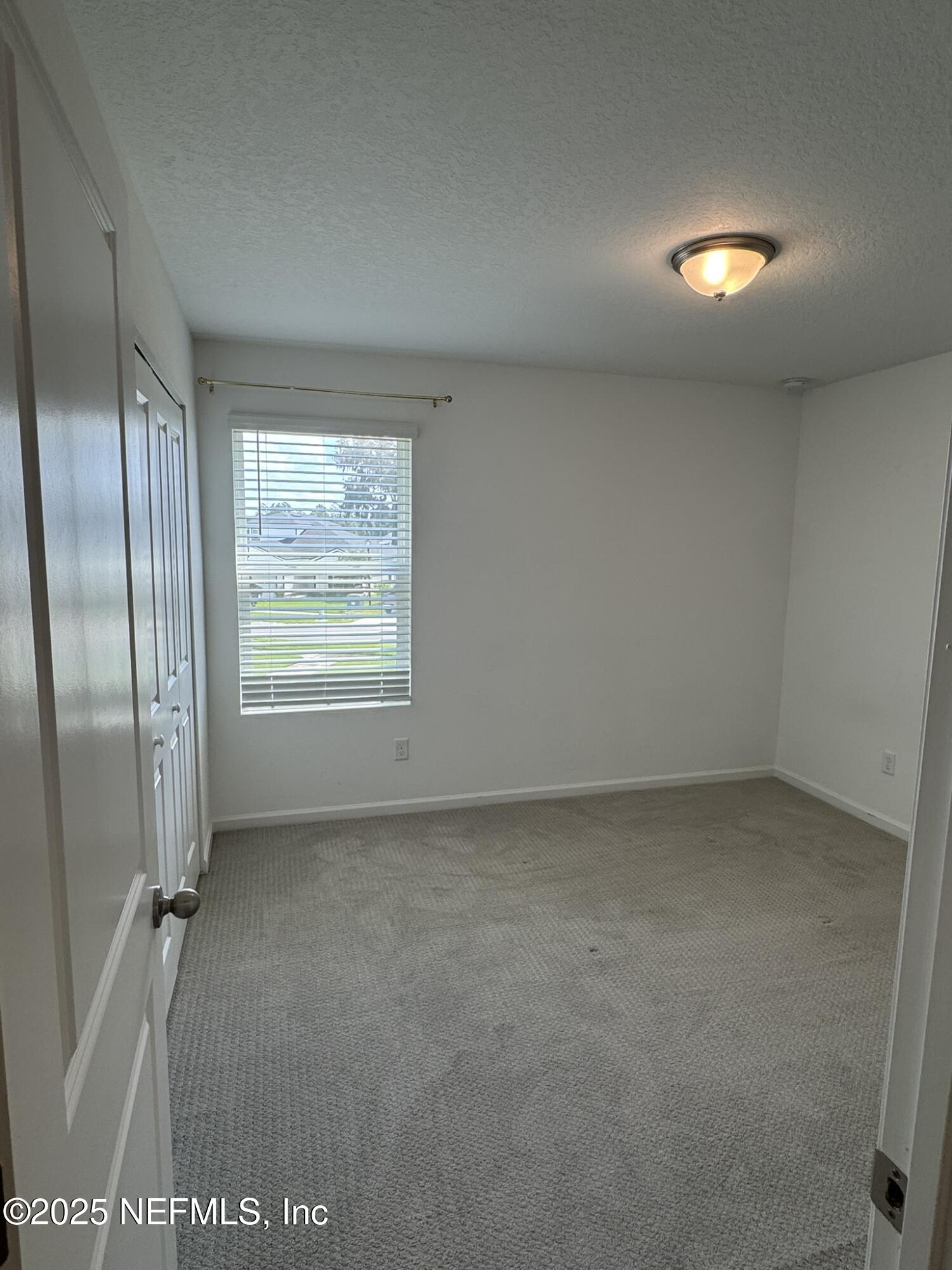 3145 Flower Branch Avenue Orange Park, FL 32073 - Photo 37 of 52 a view of an empty room with a window
