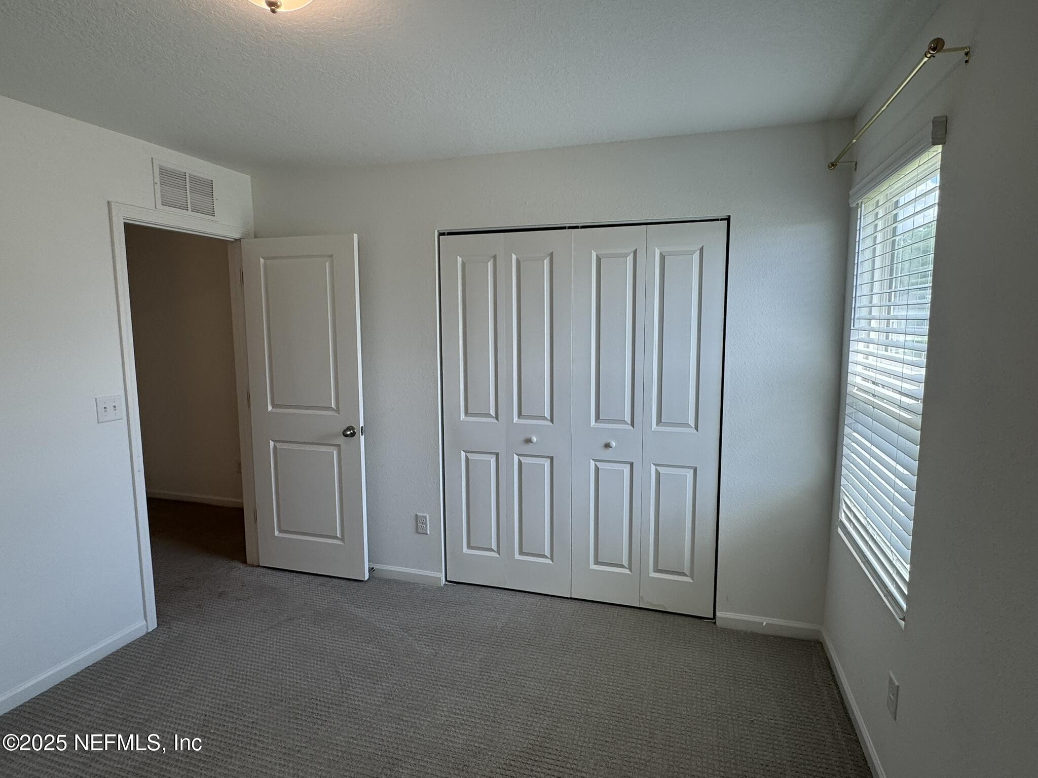 3145 Flower Branch Avenue Orange Park, FL 32073 - Photo 39 of 52 an empty room with windows