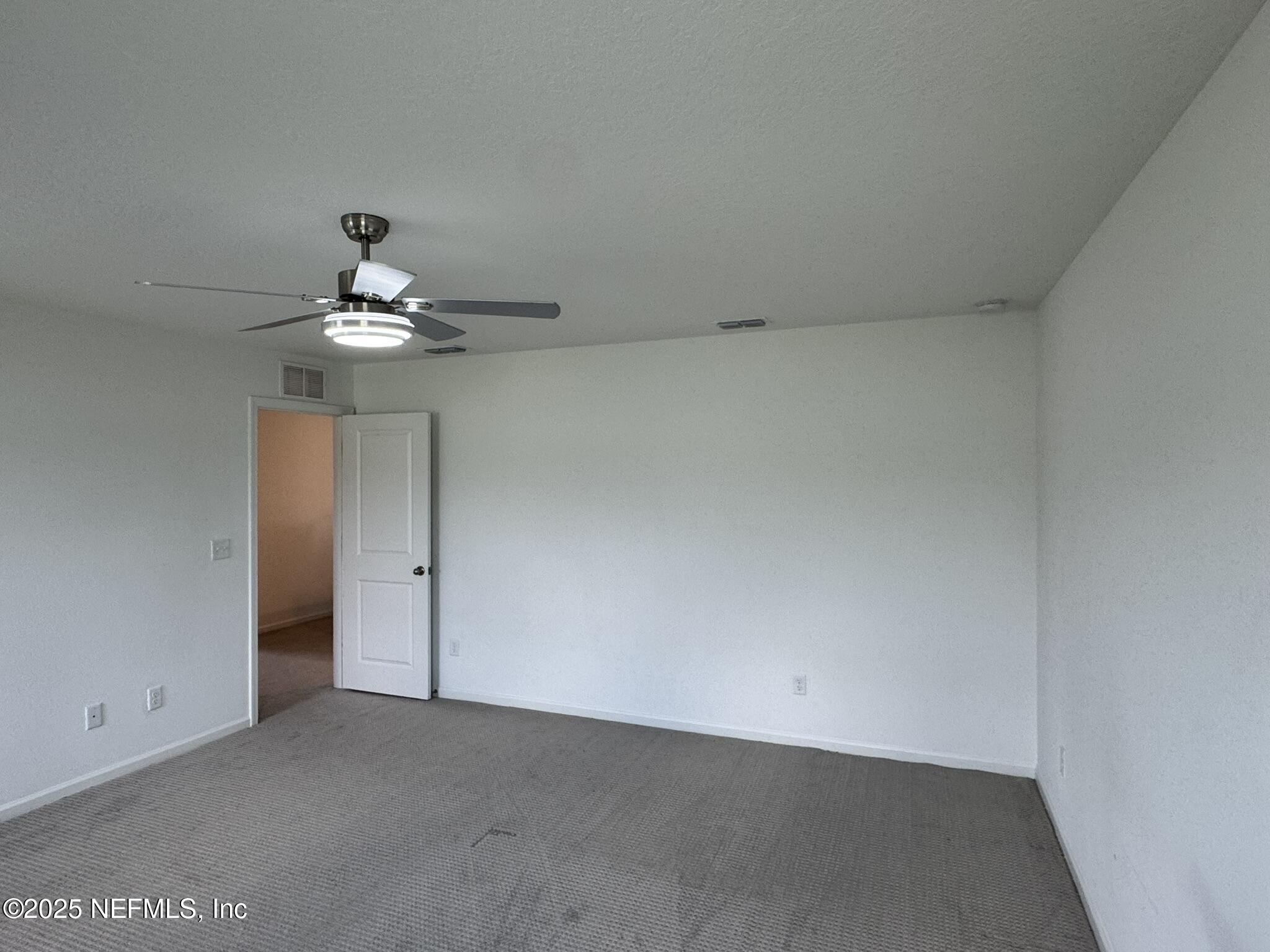 3145 Flower Branch Avenue Orange Park, FL 32073 - Photo 41 of 52 a view of an empty room with a chandelier fan