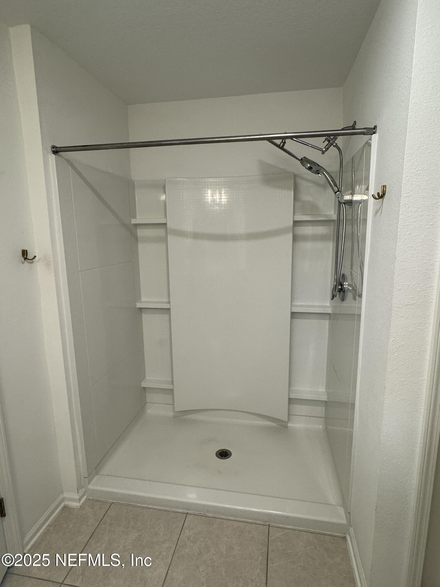 3145 Flower Branch Avenue Orange Park, FL 32073 - Photo 45 of 52 a bathroom with a glass shower door