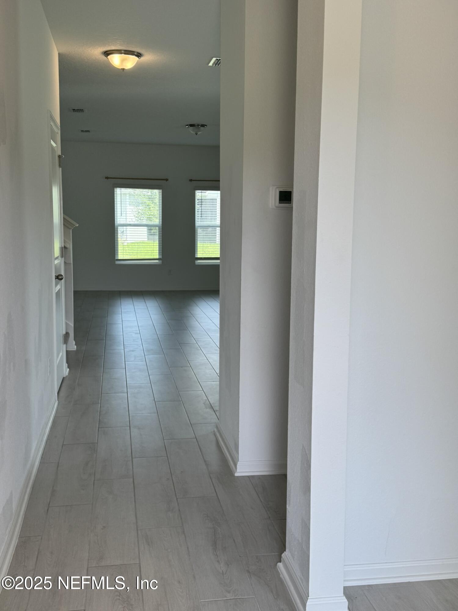 3145 Flower Branch Avenue Orange Park, FL 32073 - Photo 7 of 52 a view of an empty room and window