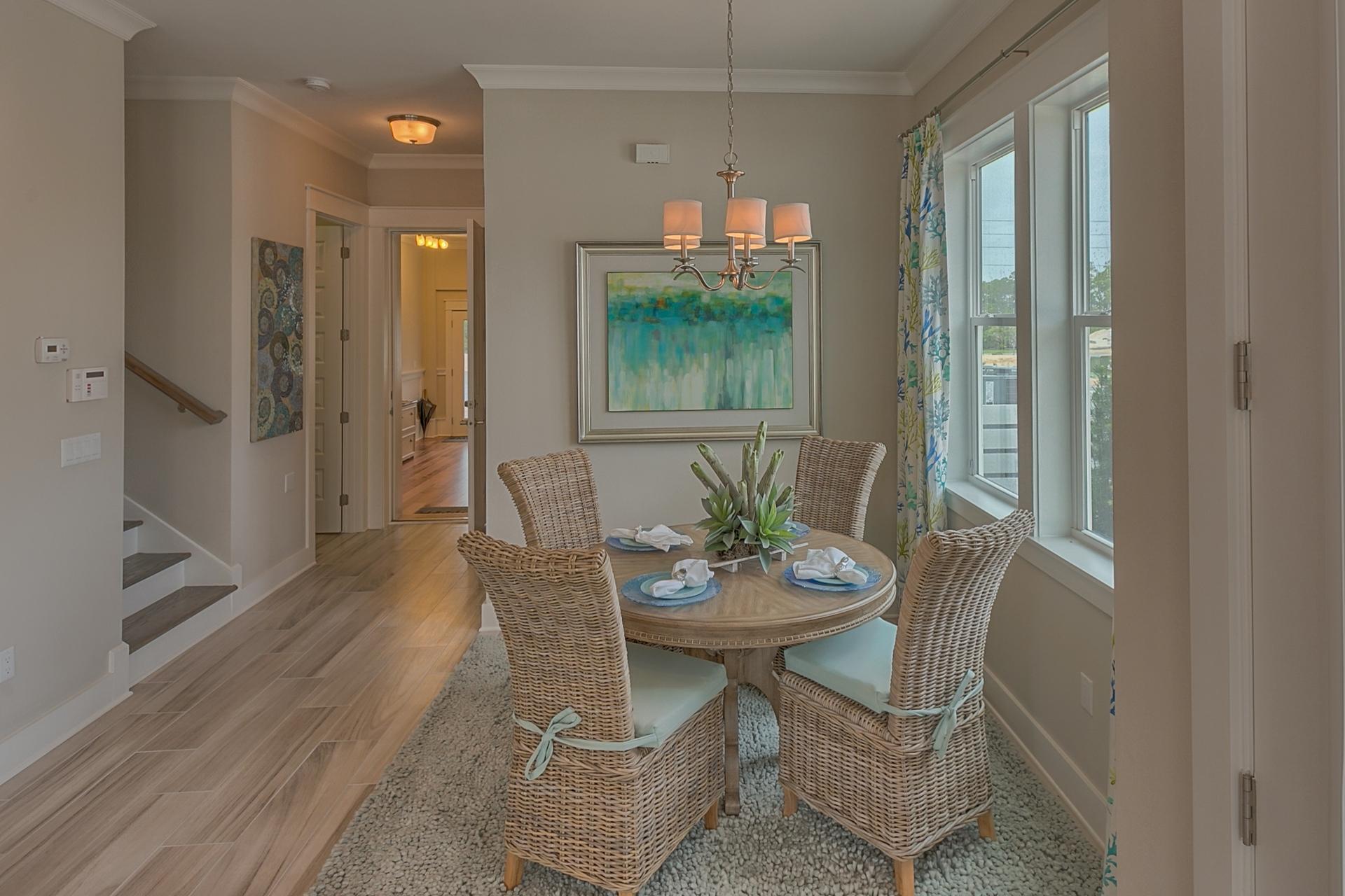 13 York Ln Inlet Beach, Unit 231 Inlet Beach, FL 32461 - Photo 22 of 30 a view of a dining room with furniture window and wooden floor