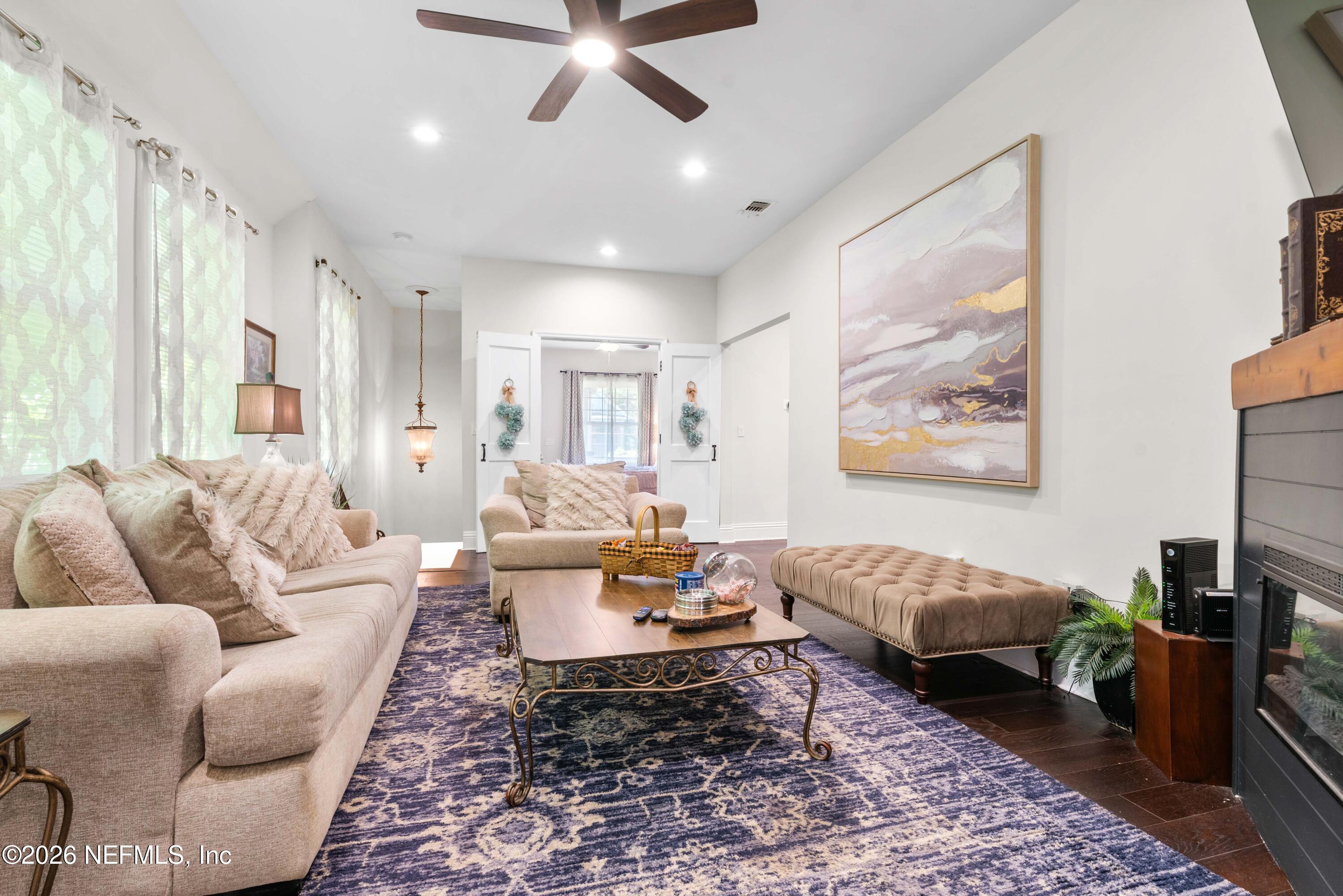 1138 Walnut Street Jacksonville, FL 32206 - Photo 21 of 37 a living room with furniture and a rug