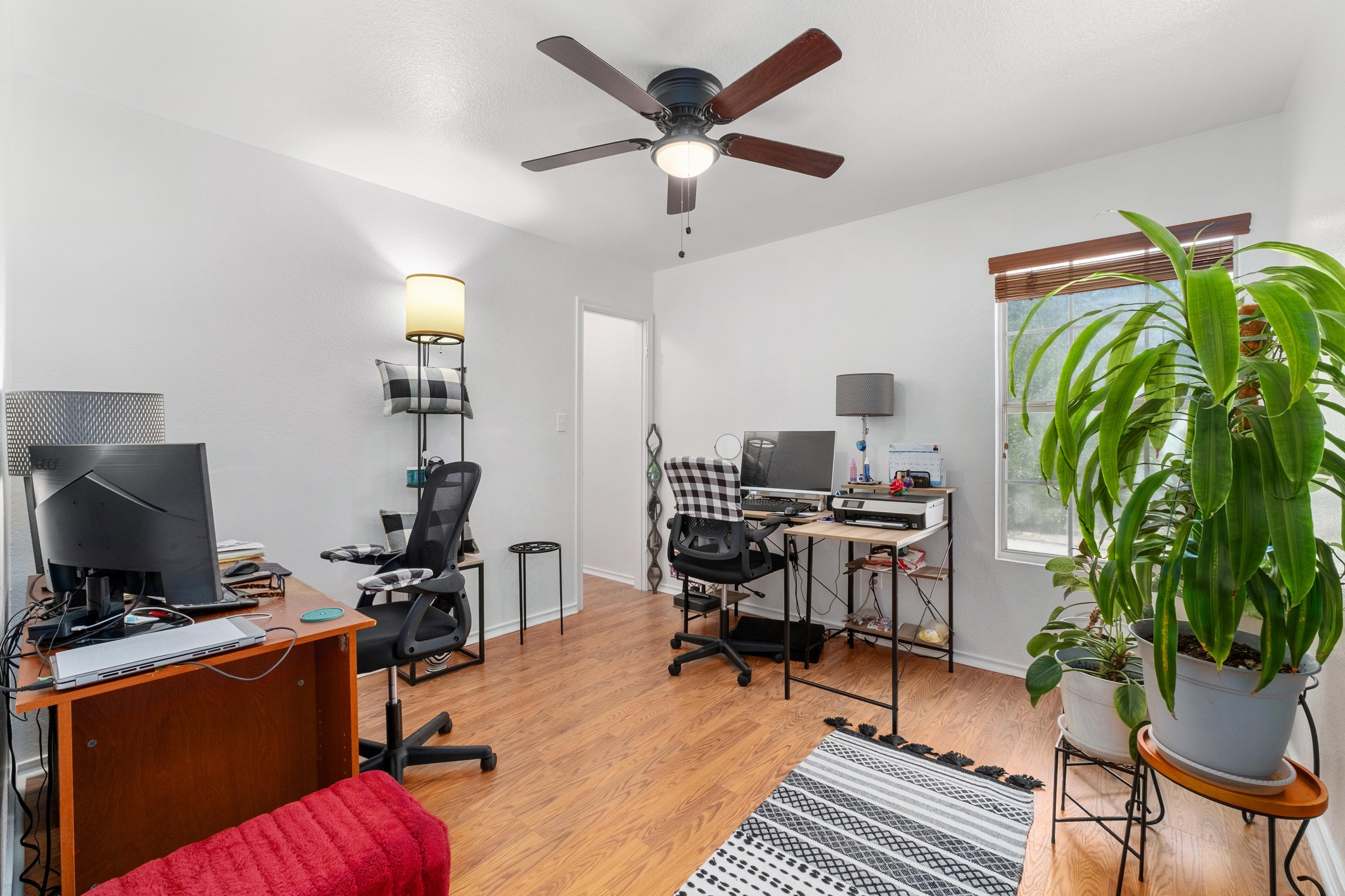 1184 Waller Street Austin, TX 78702 - Photo 11 of 19 a workspace with furniture and a potted plant