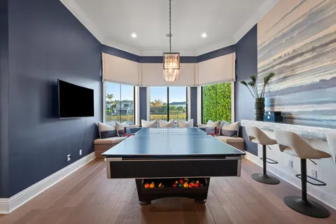 a bathroom with a granite countertop double vanity sink and a mirror
