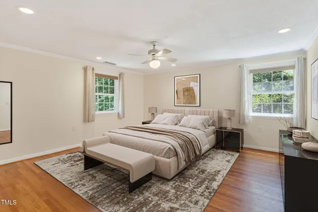 a bathroom with a granite countertop sink a toilet and a mirror