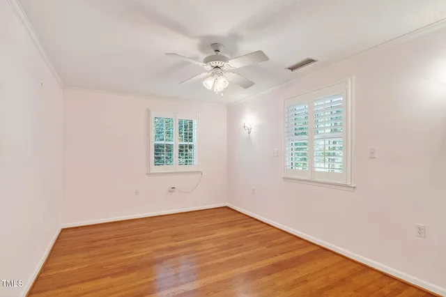 a bathroom with a sink a toilet and a shower