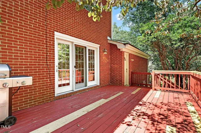 a bathroom with a granite countertop toilet sink and mirror
