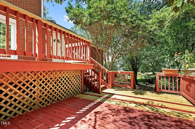 a view of backyard with a deck