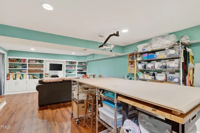 a kitchen with a refrigerator and chandelier
