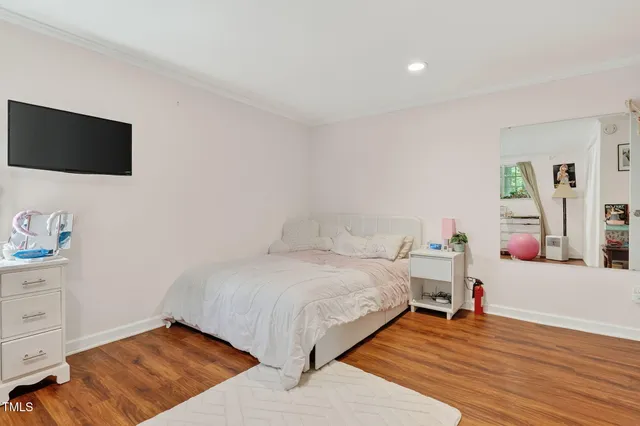 a bathroom with a granite countertop toilet sink and mirror