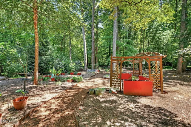 a view of a patio with table and chairs with wooden floor