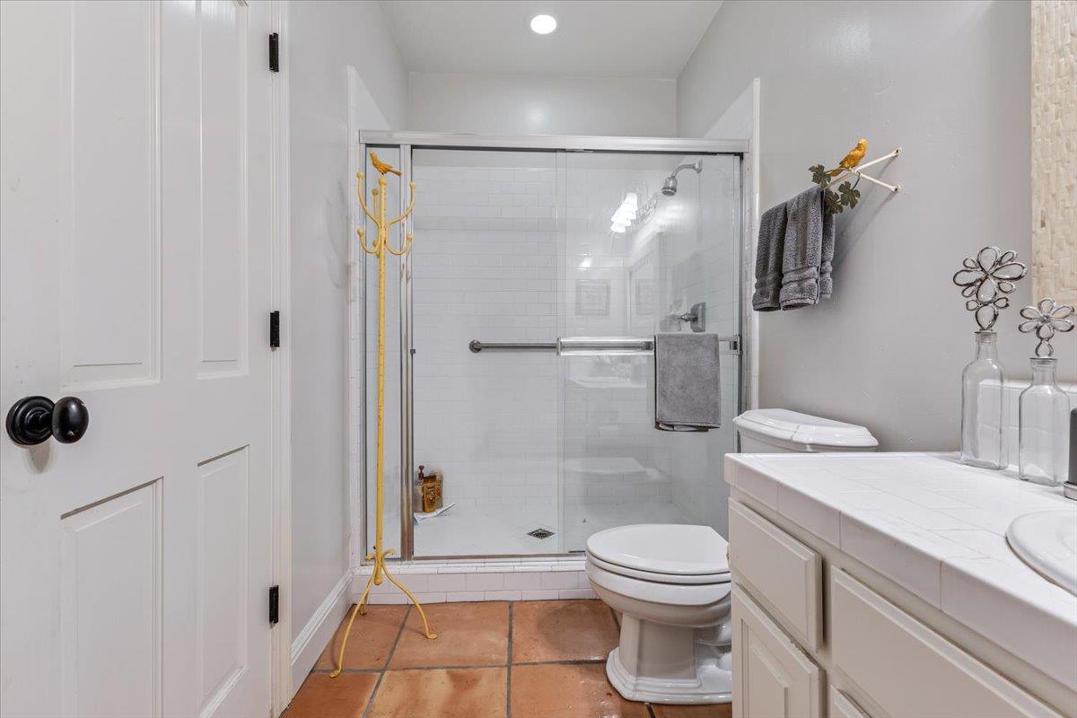 2727 Thomas Road Hollister, CA 95023 - Photo 59 of 83 a bathroom with a granite countertop sink toilet and shower
