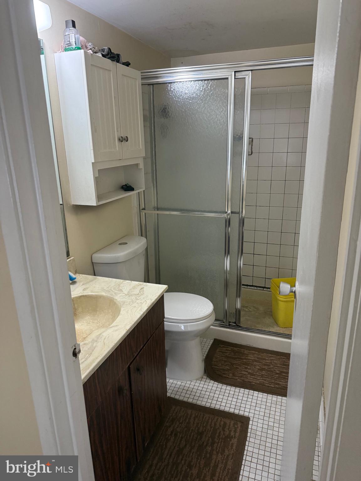 531 Florida Avenue, Unit 104 Herndon, VA 20170 - Photo 26 of 46 a bathroom with a sink a toilet and shower