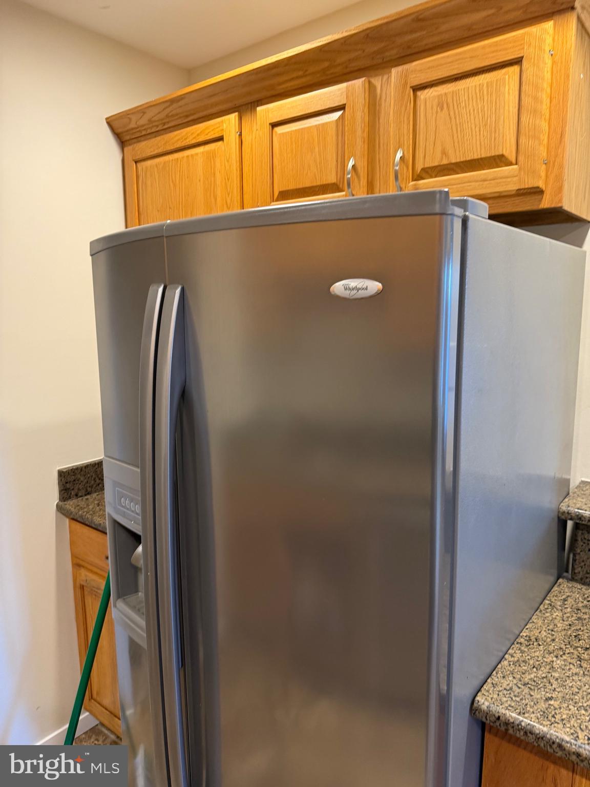531 Florida Avenue, Unit 104 Herndon, VA 20170 - Photo 8 of 46 a view of a refrigerator in kitchen