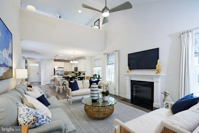 a living room with furniture fireplace and flat screen tv