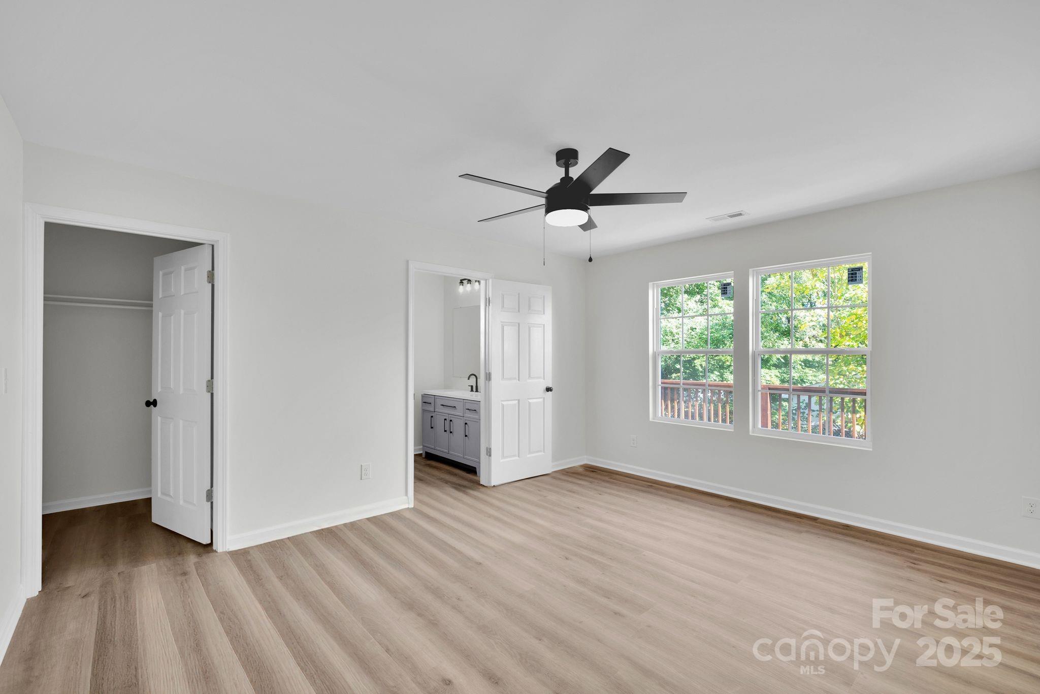 808 3rd Street Kings Mountain, NC 28086 - Photo 12 of 30 a view of an empty room with a window and wooden floor