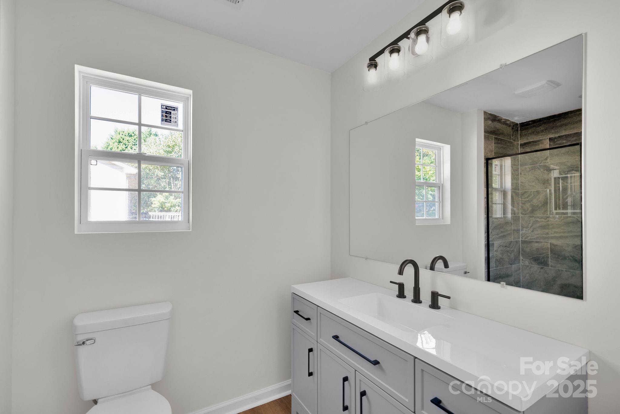 808 3rd Street Kings Mountain, NC 28086 - Photo 17 of 30 a bathroom with a sink toilet and shower