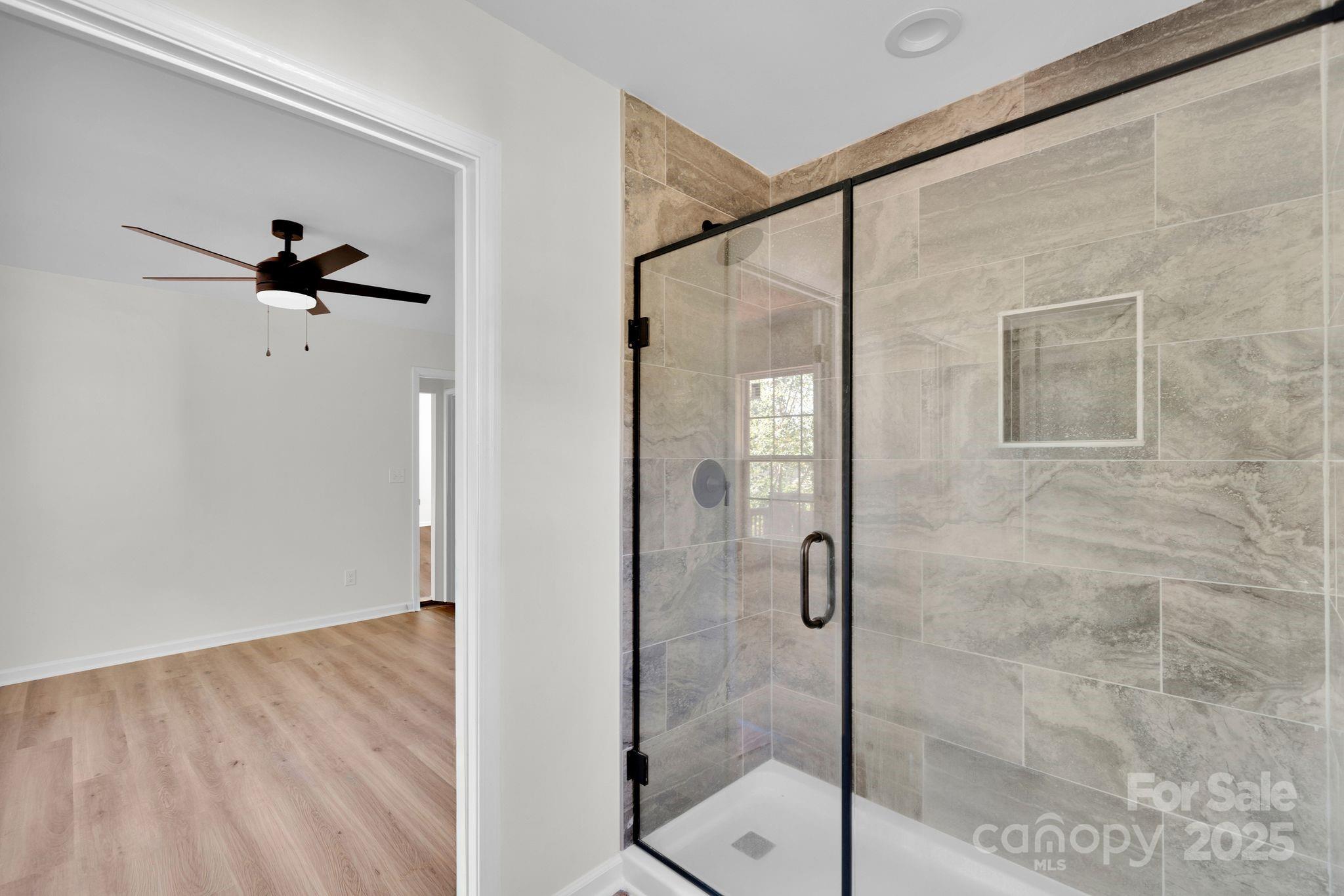 808 3rd Street Kings Mountain, NC 28086 - Photo 19 of 30 a bathroom with a glass shower door