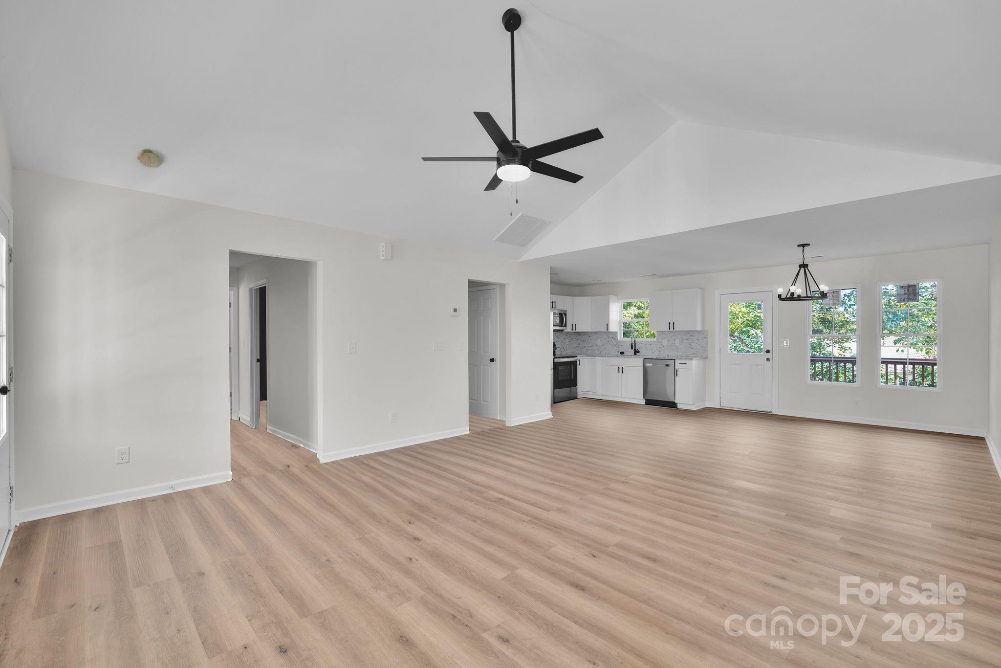 808 3rd Street Kings Mountain, NC 28086 - Photo 7 of 30 a view of an empty room with window and wooden floor
