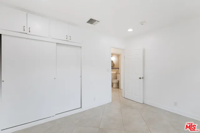 a view of an empty room with glass door