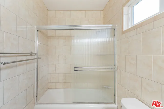 a backyard of a house with a yard and outdoor seating