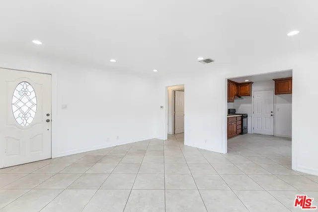 an empty room with a empty space and window