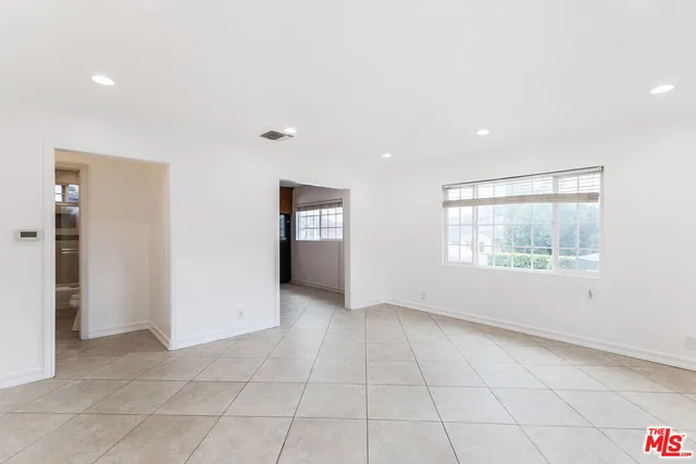 a kitchen with stainless steel appliances granite countertop a refrigerator sink and cabinets