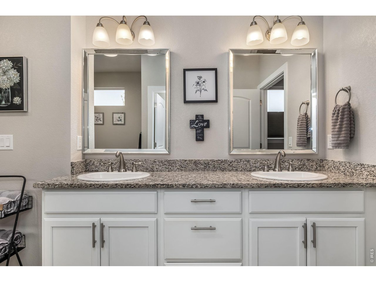 3789 Bridle Ridge Circle Severance, CO 80524 - Photo 26 of 44 a bathroom with a granite countertop sink and a mirror