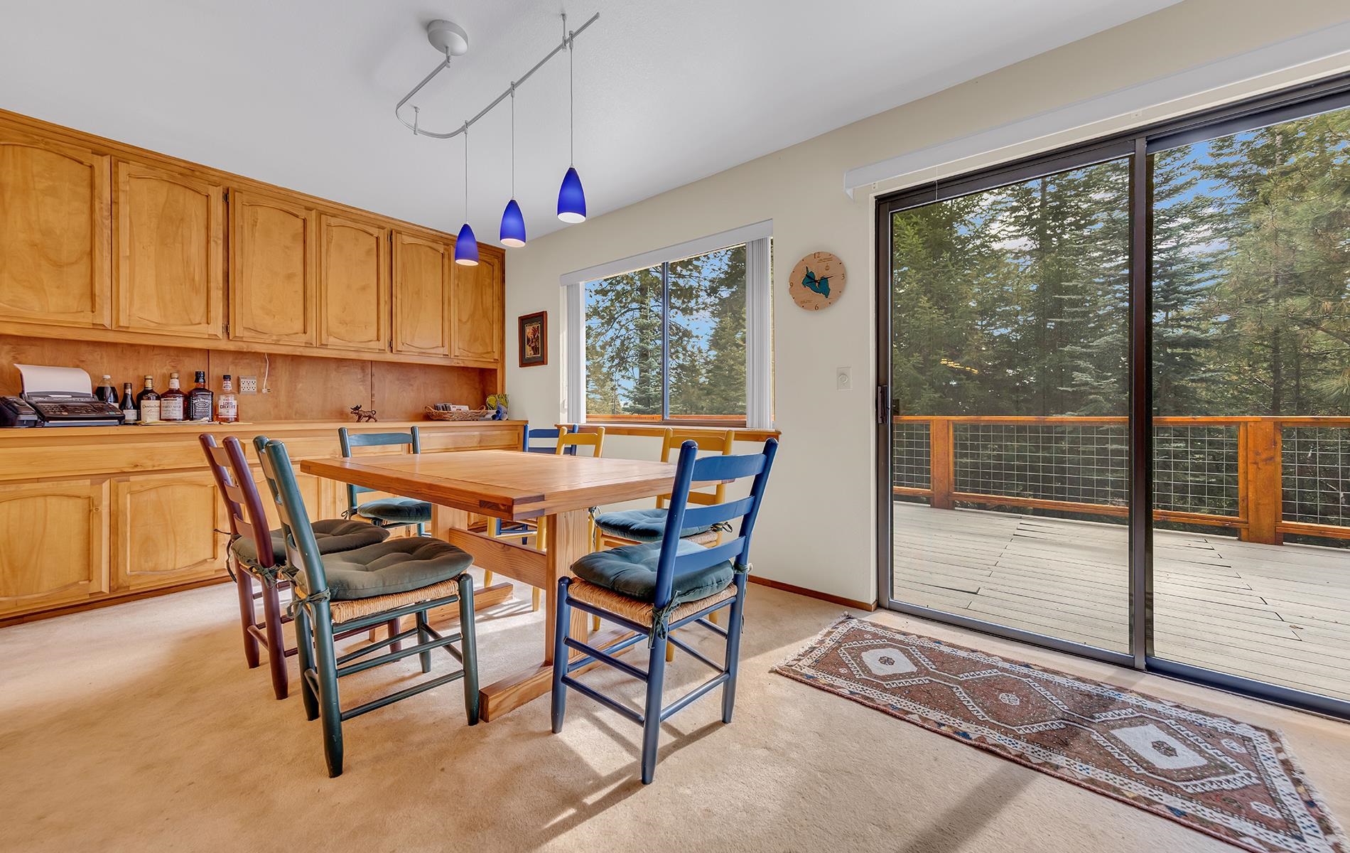 608 East Burnt Cedar Road Lake Almanor, CA 96137 - Photo 13 of 36 a dining room with furniture and a floor to ceiling window