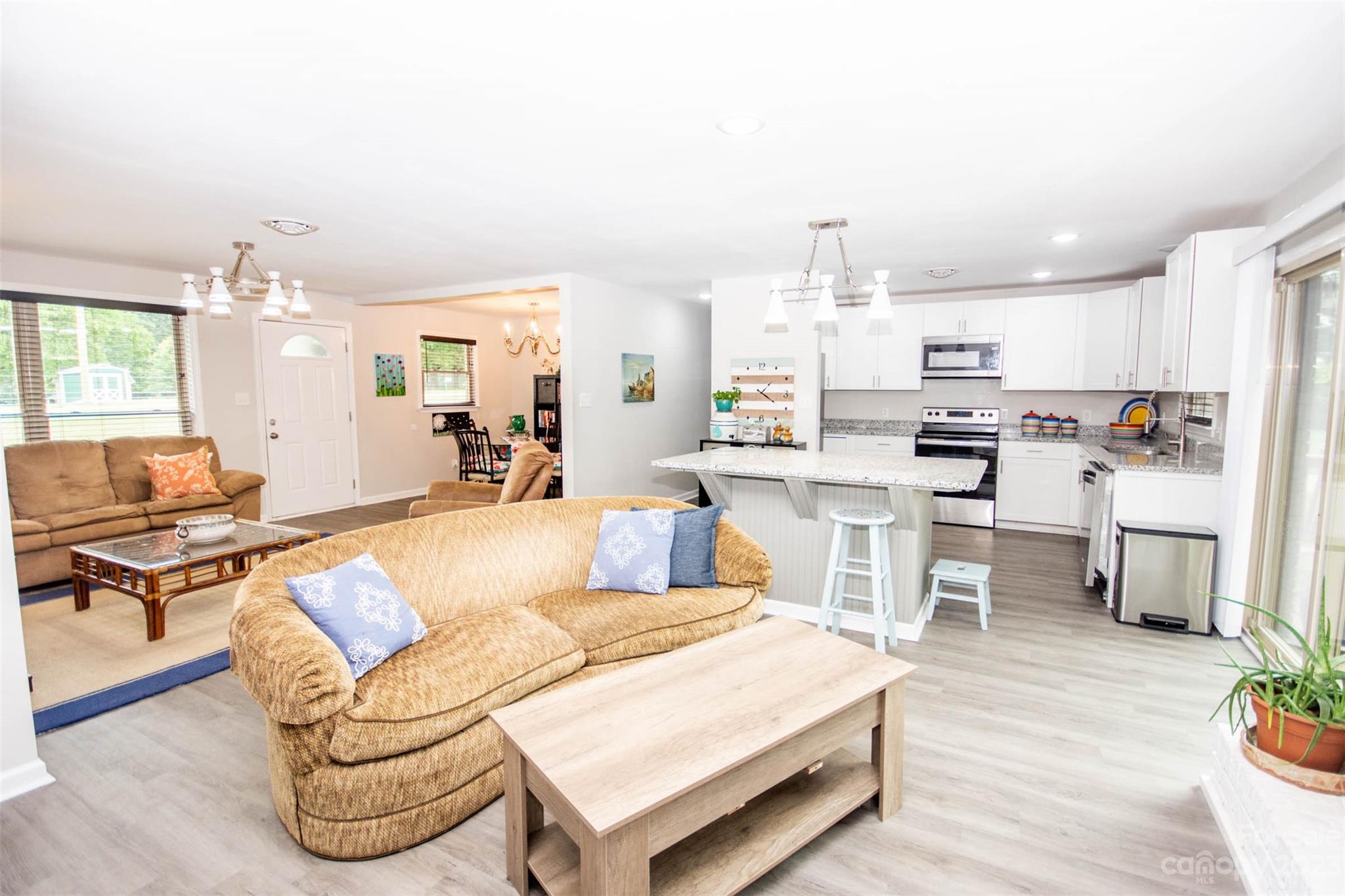 357 Pop Davis Road Taylorsville, NC 28681 - Photo 11 of 45 a living room with furniture and a kitchen view