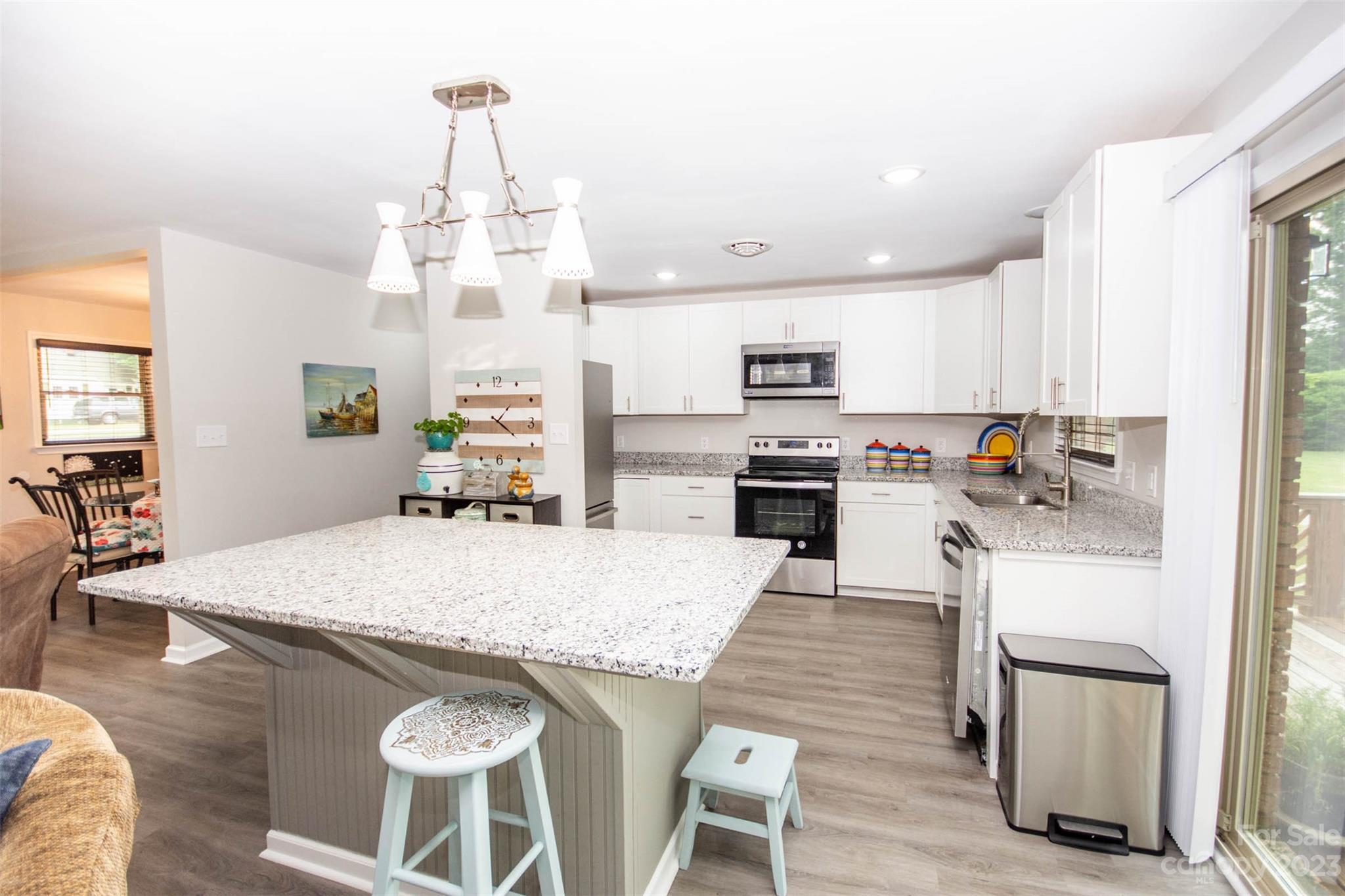 357 Pop Davis Road Taylorsville, NC 28681 - Photo 12 of 45 a large kitchen with kitchen island a large island in it