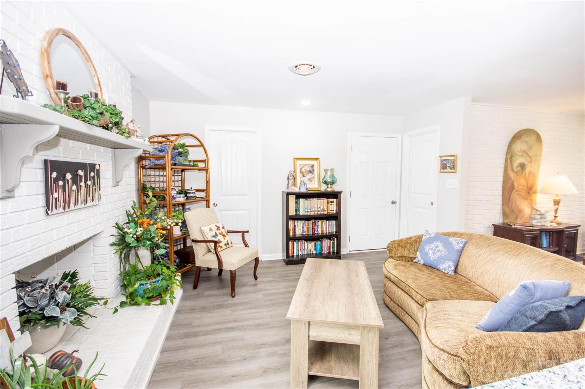 357 Pop Davis Road Taylorsville, NC 28681 - Photo 14 of 45 a living room with furniture and a potted plant