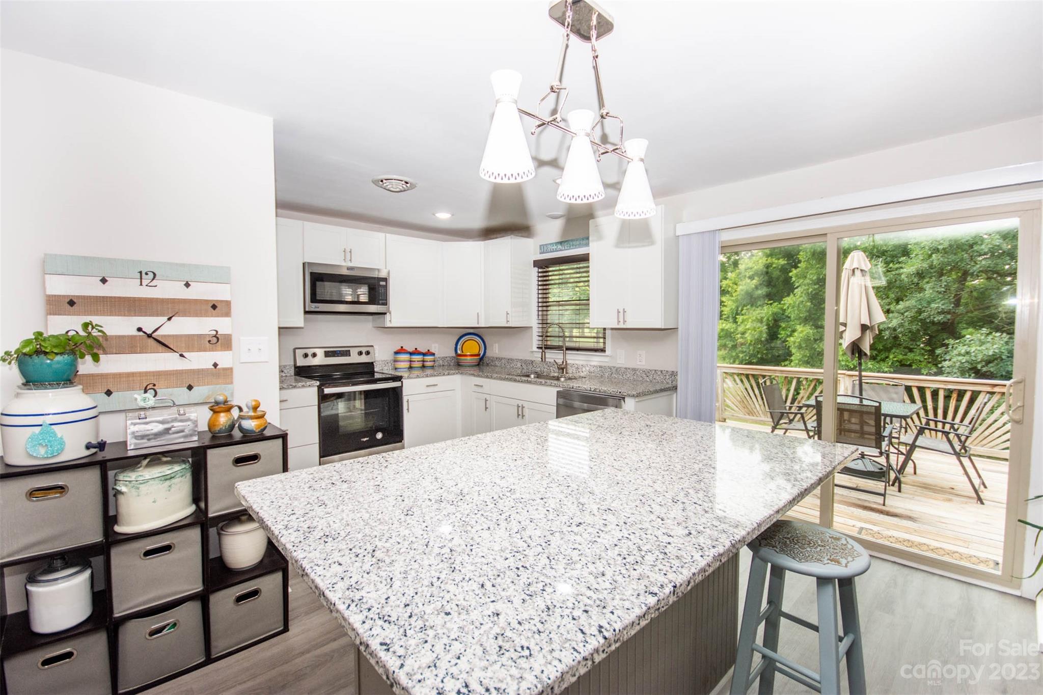 357 Pop Davis Road Taylorsville, NC 28681 - Photo 16 of 45 a large kitchen with kitchen island a large counter space and stainless steel appliances