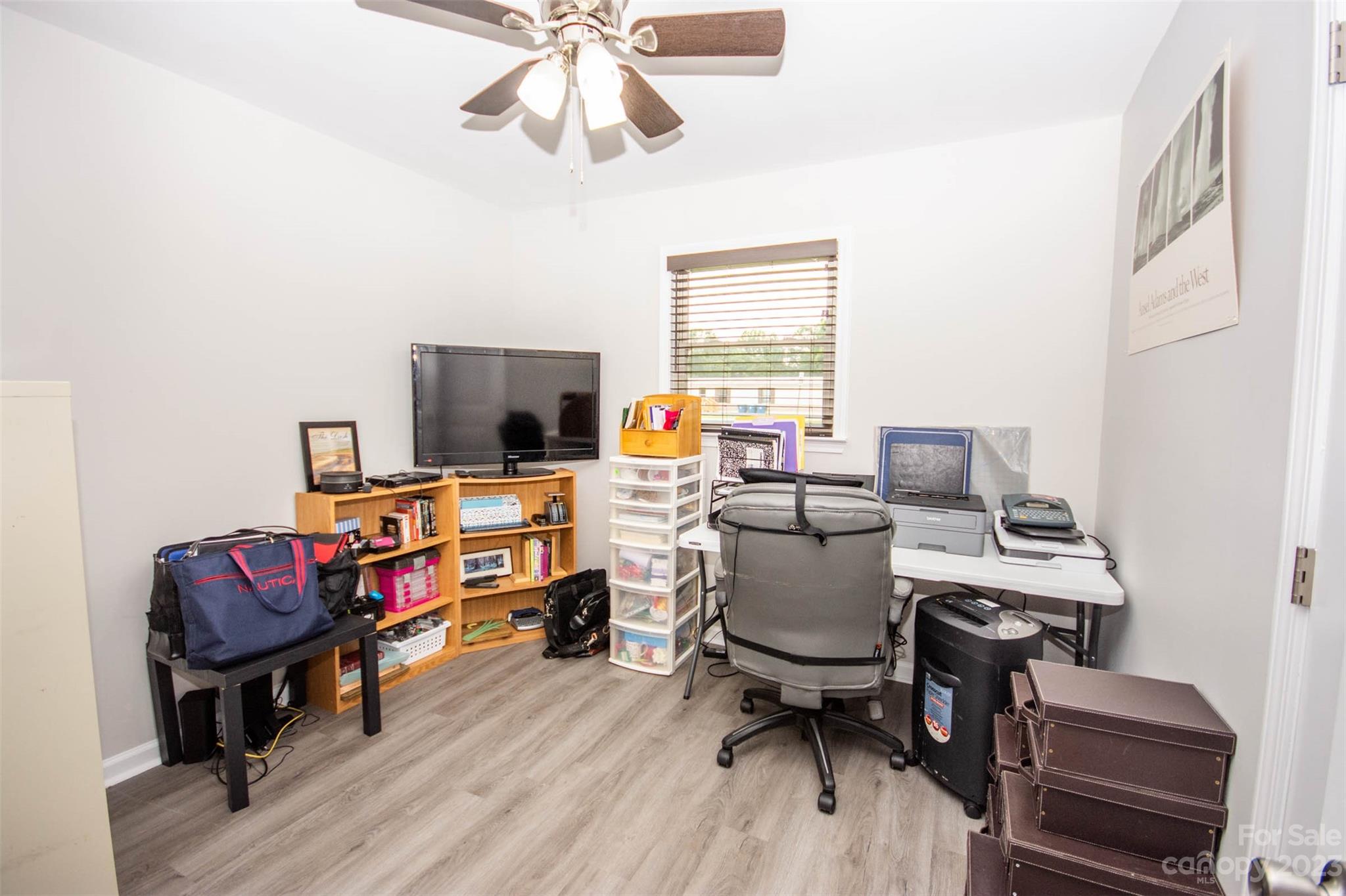 357 Pop Davis Road Taylorsville, NC 28681 - Photo 22 of 45 a view of a workspace with furniture and a window