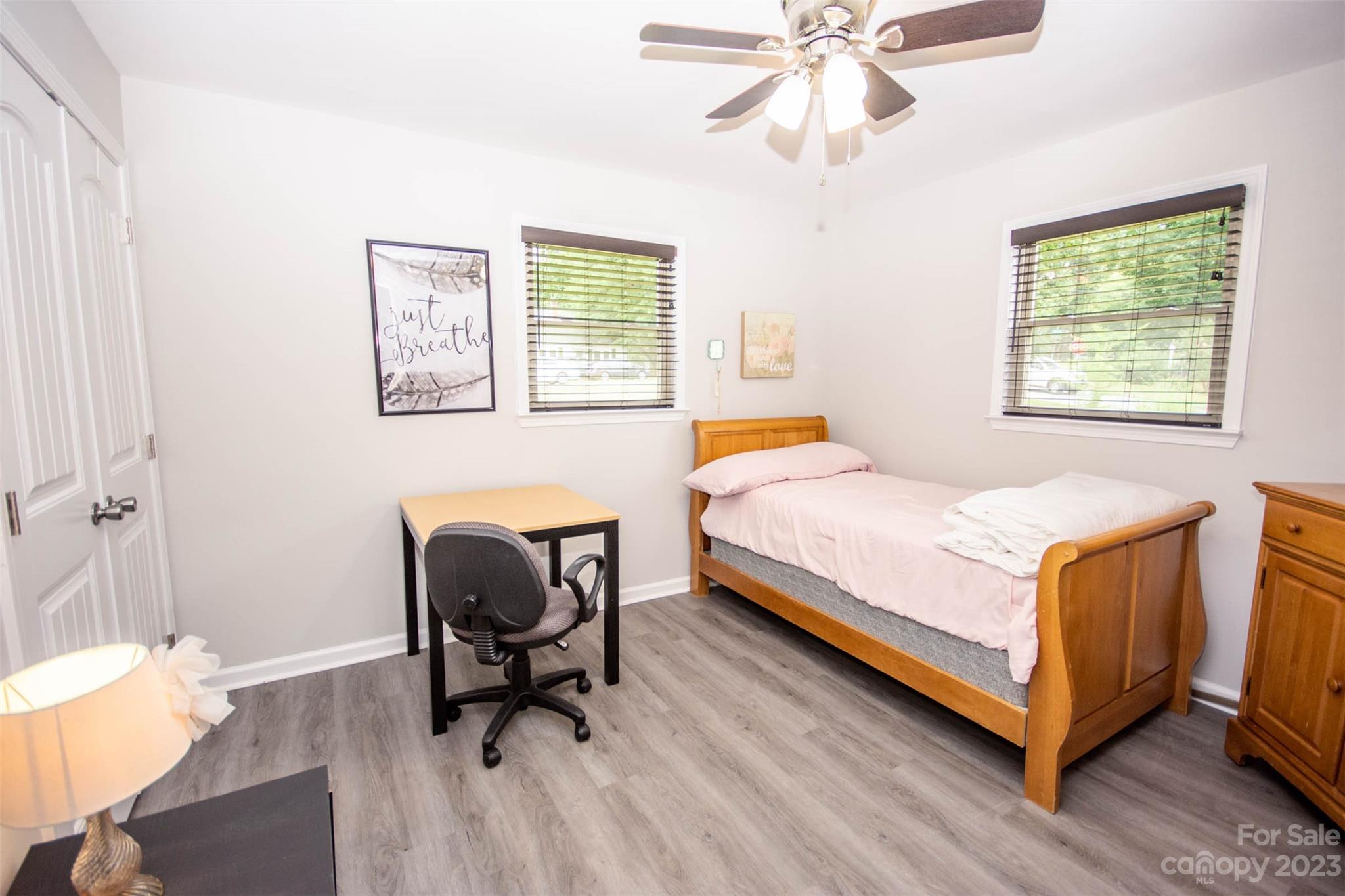 357 Pop Davis Road Taylorsville, NC 28681 - Photo 23 of 45 a bedroom with a bed and a chair