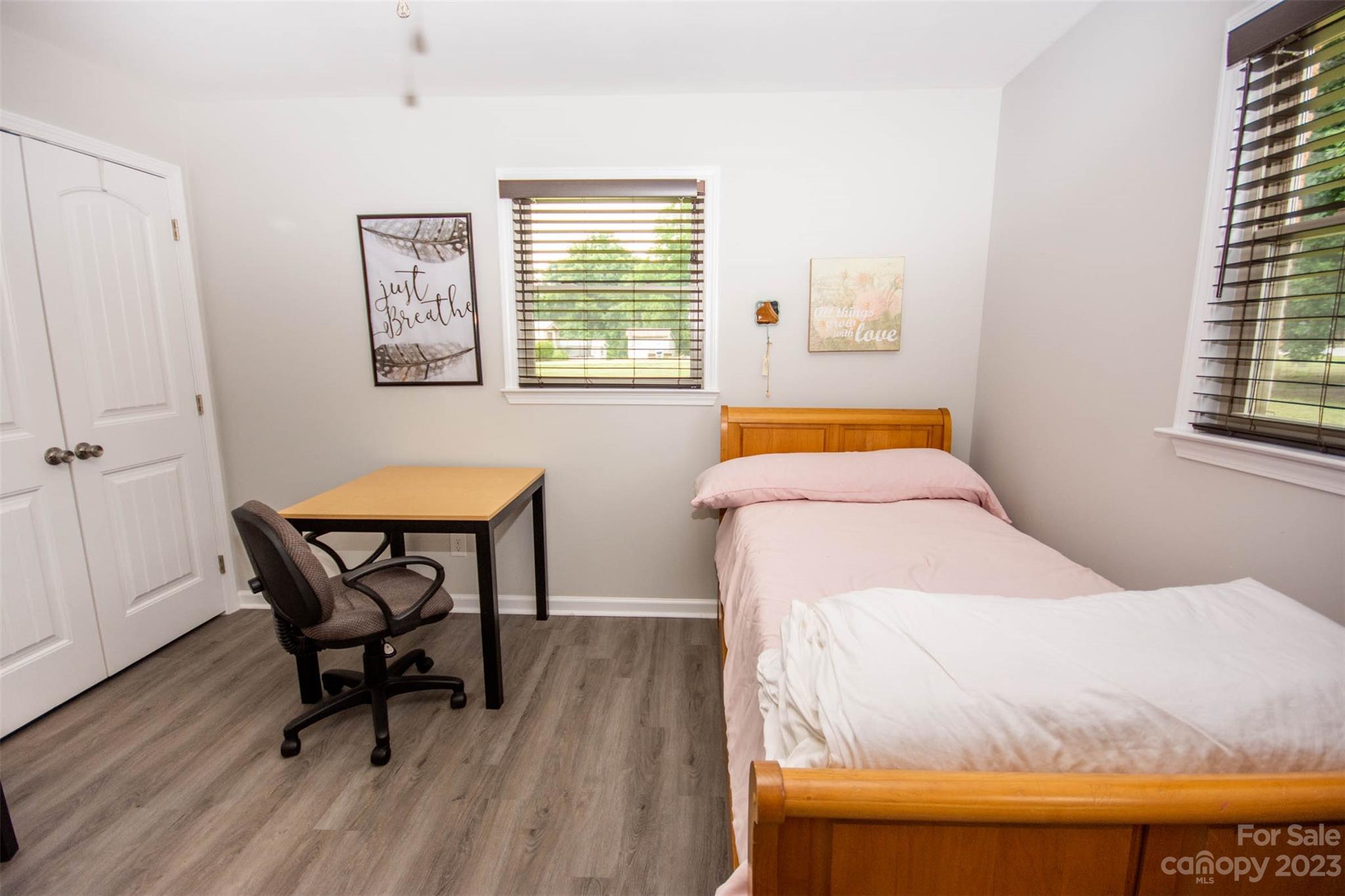 357 Pop Davis Road Taylorsville, NC 28681 - Photo 24 of 45 a bedroom with a bed and a table