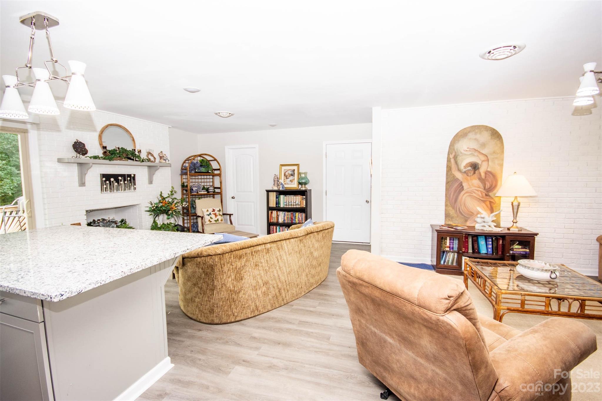 357 Pop Davis Road Taylorsville, NC 28681 - Photo 28 of 45 a living room with furniture and wooden floor