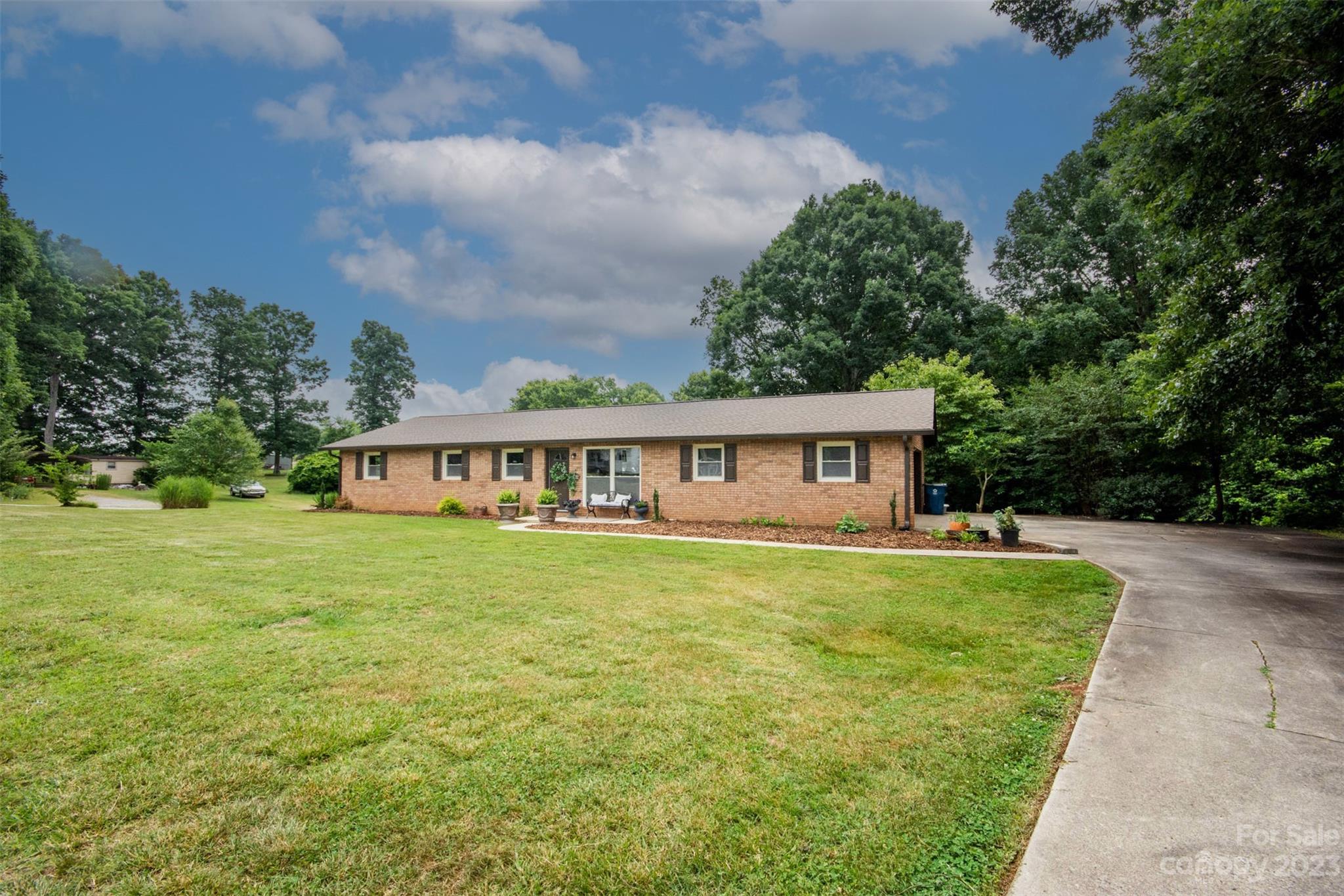 357 Pop Davis Road Taylorsville, NC 28681 - Photo 3 of 45 a view of a house with yard and a garden