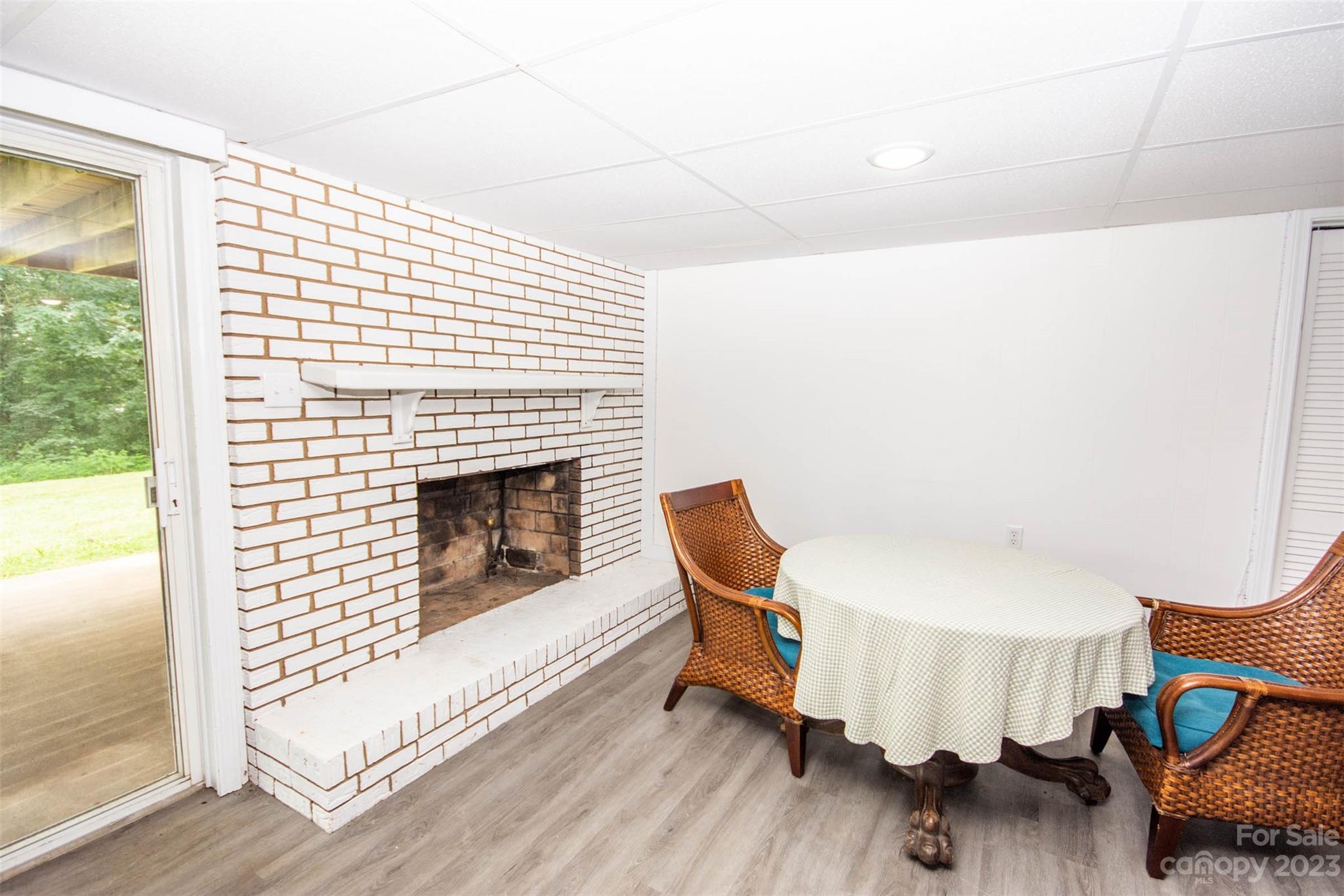 357 Pop Davis Road Taylorsville, NC 28681 - Photo 32 of 45 a living room with furniture and a fireplace
