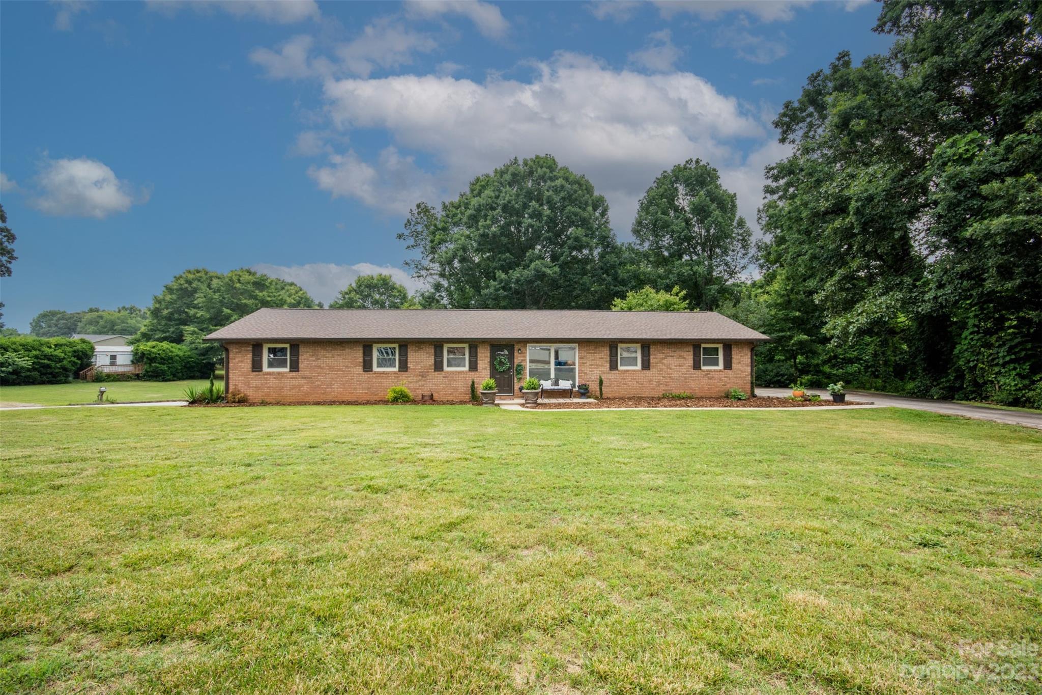 357 Pop Davis Road Taylorsville, NC 28681 - Photo 37 of 45 a front view of a house with a garden