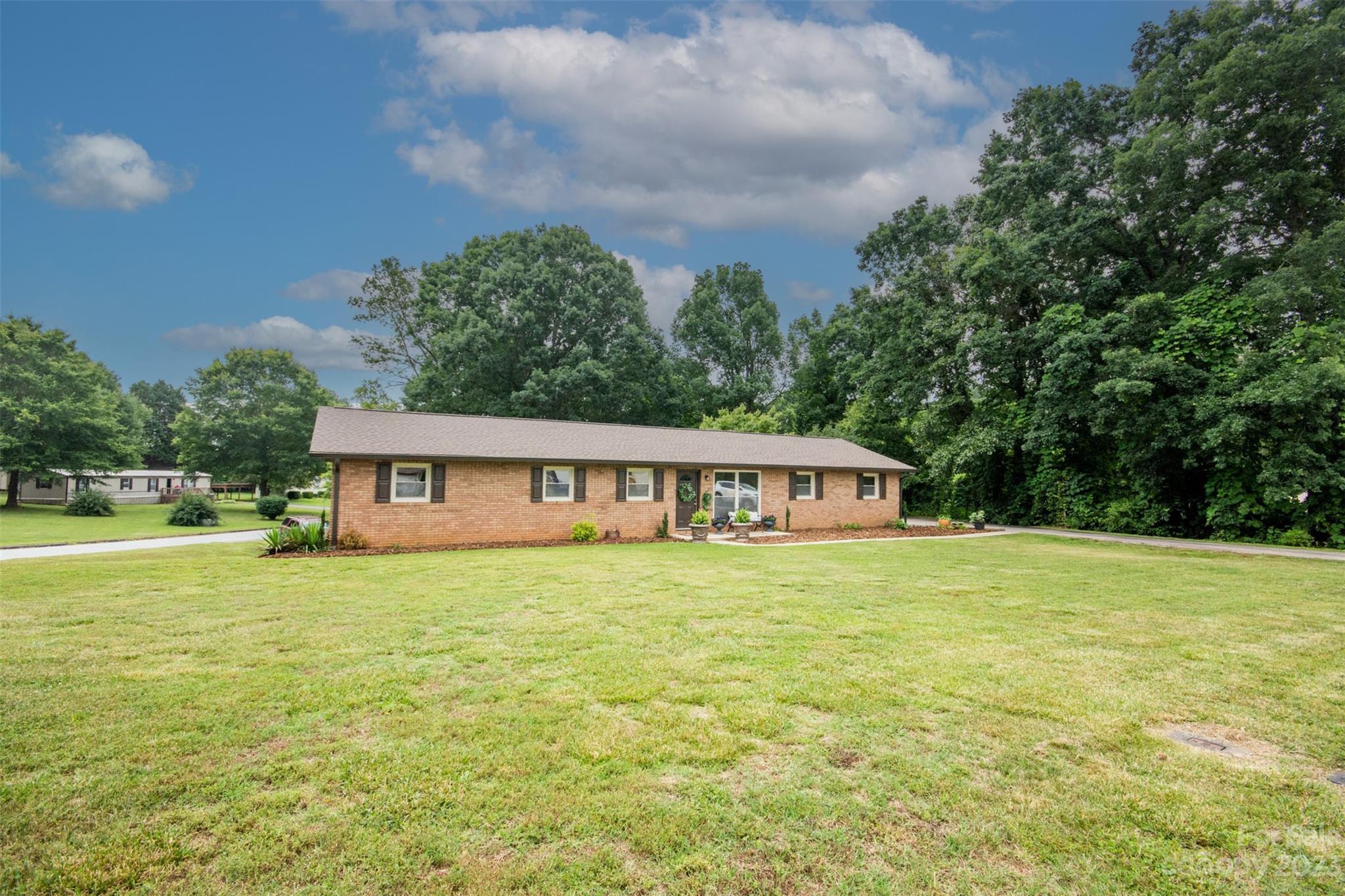 357 Pop Davis Road Taylorsville, NC 28681 - Photo 38 of 45 a house view with a garden space
